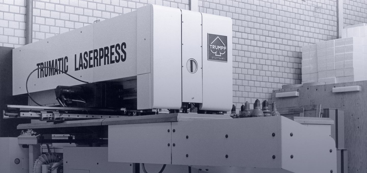 historical picture showing a combined punching and laser-cutting machine of TRUMPF