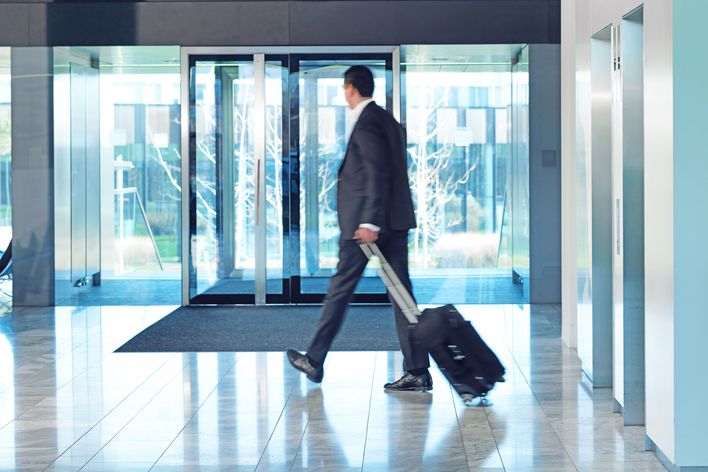 A TRUMPF employee is leaving a building